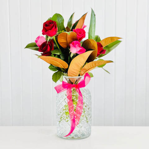Lush Roses In A Glass Vase